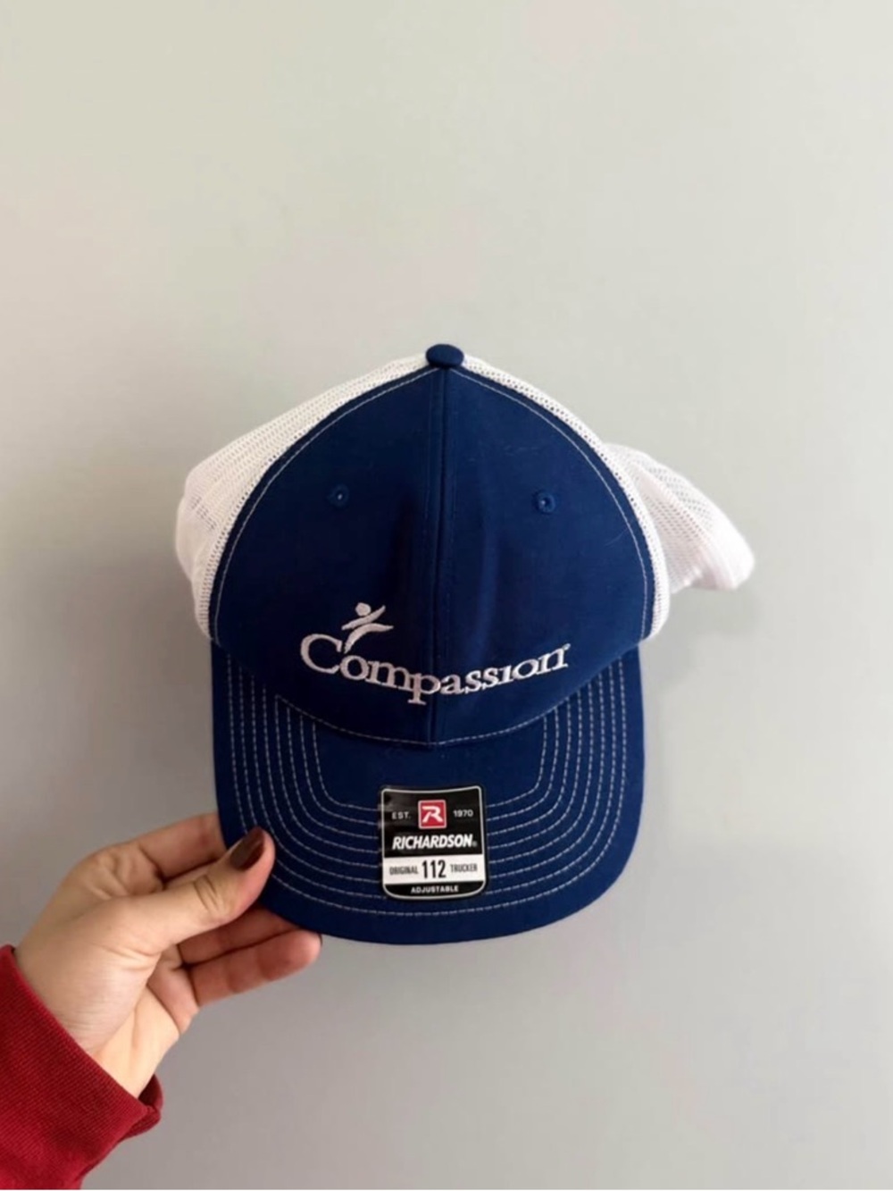 Compassion Embroidered Trucker Hat - Navy & White